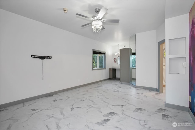 unfurnished room featuring ceiling fan