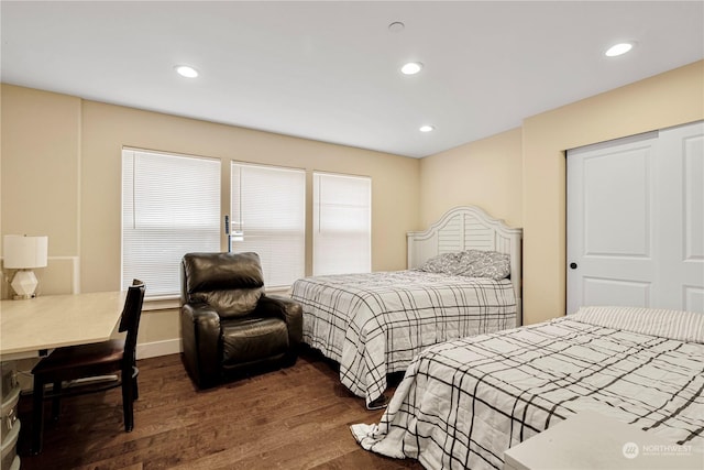 bedroom featuring dark wood-type flooring