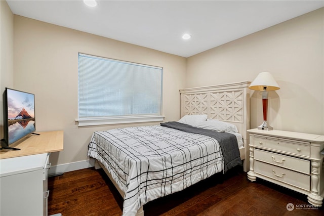 bedroom with dark wood-type flooring