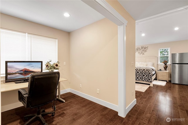 home office with dark hardwood / wood-style floors