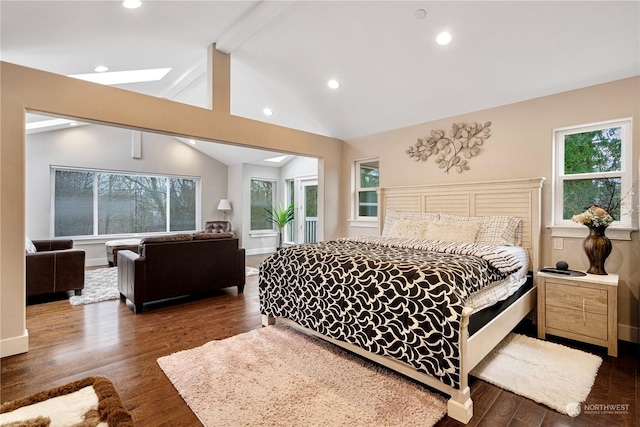 bedroom with multiple windows, dark wood-type flooring, and lofted ceiling with beams