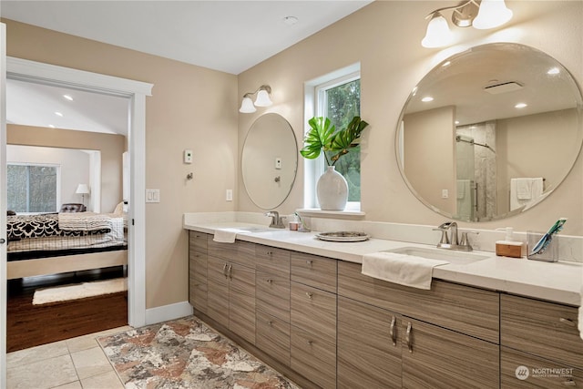 bathroom with tile patterned floors, an enclosed shower, and vanity