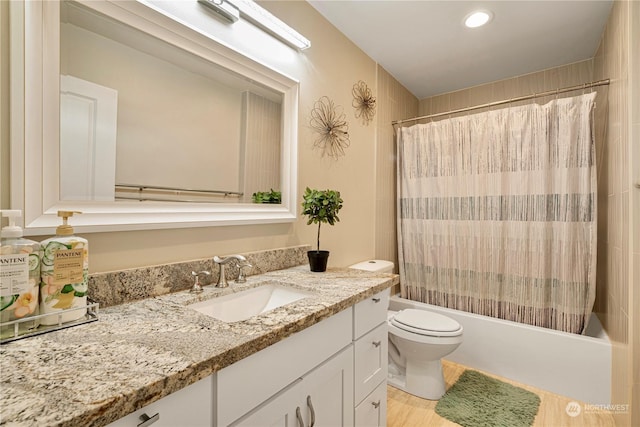 full bathroom featuring vanity, toilet, and shower / tub combo