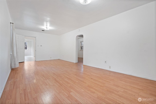 unfurnished room featuring light hardwood / wood-style floors