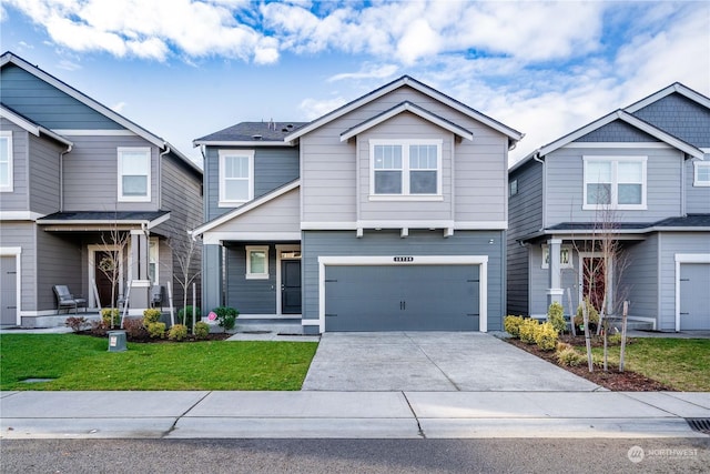 craftsman-style home with a garage and a front lawn