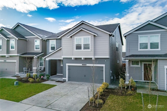 view of front of house featuring a garage and a front yard