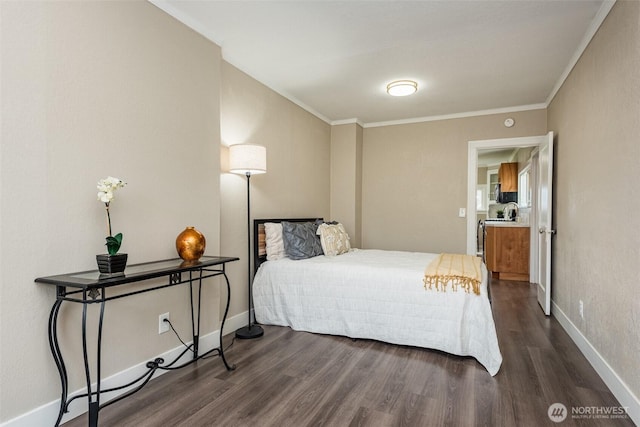 bedroom featuring dark wood finished floors, crown molding, and baseboards