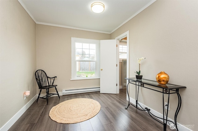 living area with dark wood finished floors, crown molding, baseboards, and a baseboard radiator