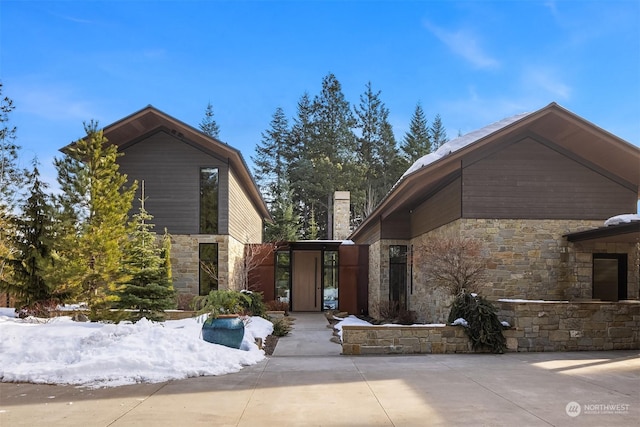 exterior space featuring stone siding