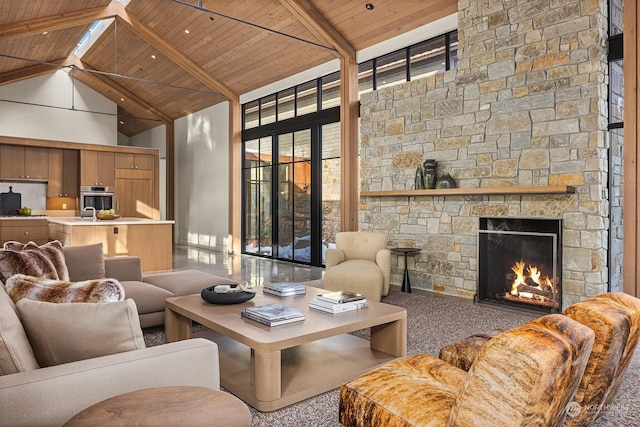 living room featuring beam ceiling, high vaulted ceiling, a stone fireplace, and wooden ceiling