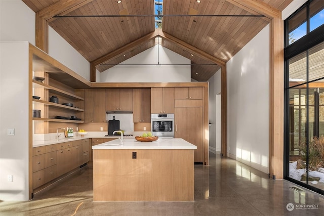 kitchen featuring high vaulted ceiling, sink, oven, a center island with sink, and wooden ceiling