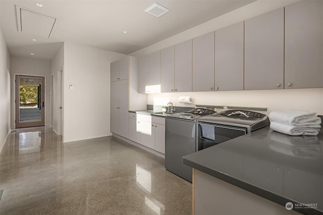 kitchen with washer and dryer and sink