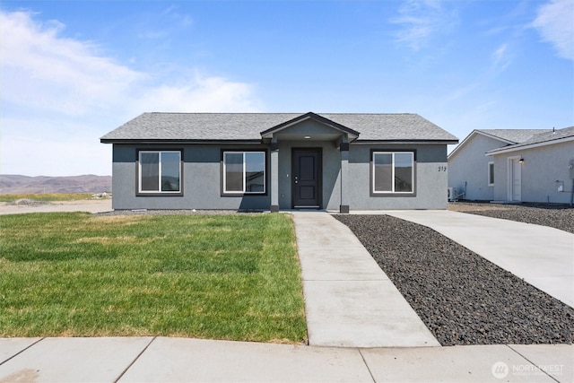 204 Cherry St, Mattawa, WA 99349 - single story home with a front yard, stucco siding, and a shingled roof