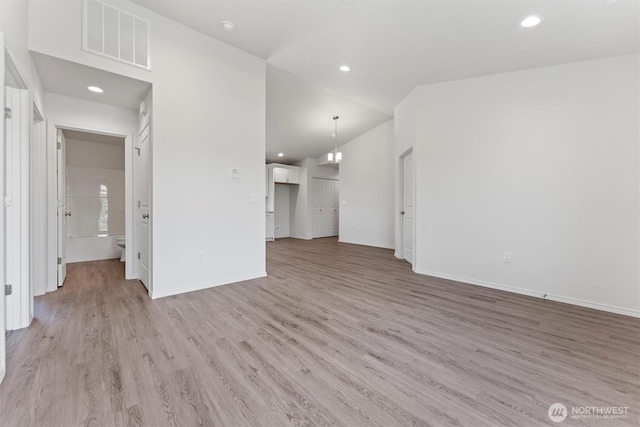 204 Cherry St, Mattawa, WA 99349 - unfurnished living room with light wood-style floors, recessed lighting, and lofted ceiling