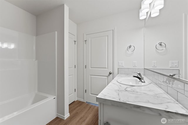 204 Cherry St, Mattawa, WA 99349 - full bath featuring vanity, wood finished floors, and shower / bath combination