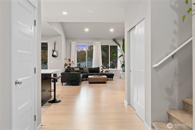 corridor with light hardwood / wood-style floors