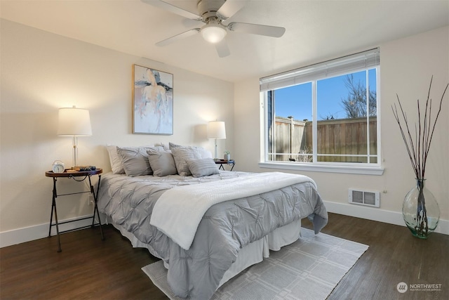 bedroom with ceiling fan and dark hardwood / wood-style flooring