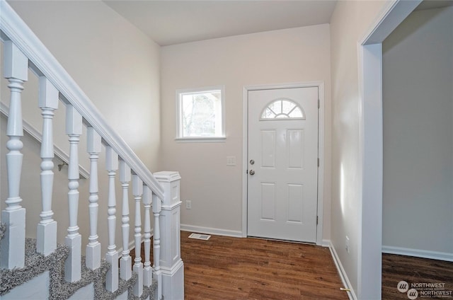 entrance foyer featuring dark hardwood / wood-style flooring