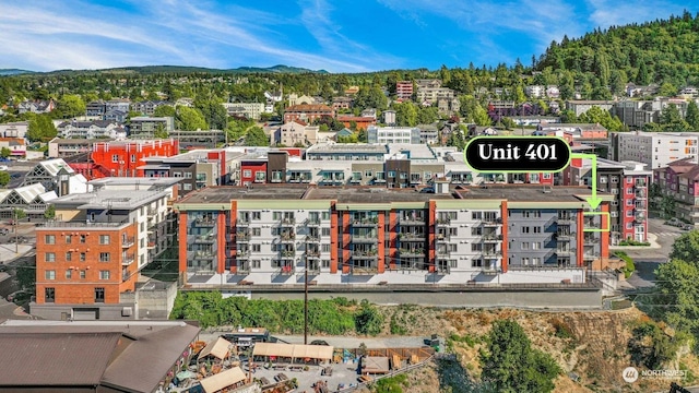 birds eye view of property with a mountain view