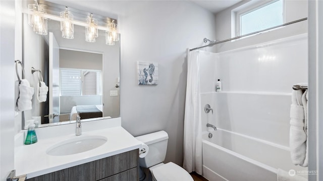 full bathroom with vanity, toilet, and shower / tub combo