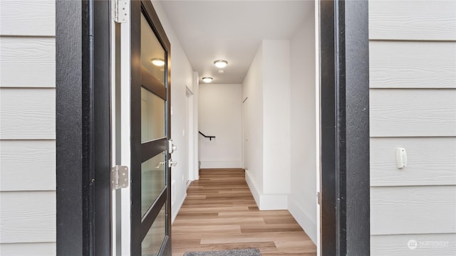 hallway featuring hardwood / wood-style floors