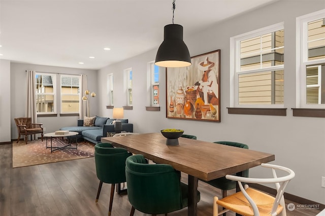 dining space featuring dark hardwood / wood-style floors