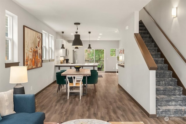 dining space with dark wood-type flooring