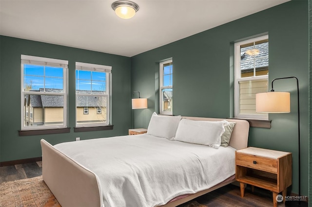 bedroom featuring dark wood-type flooring