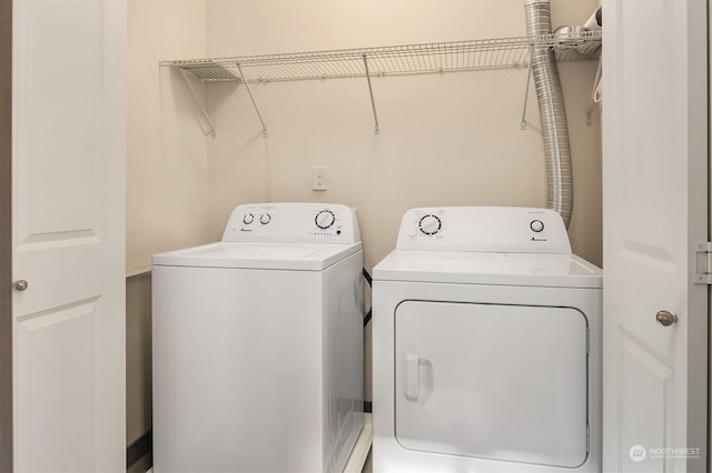 washroom with washer and dryer