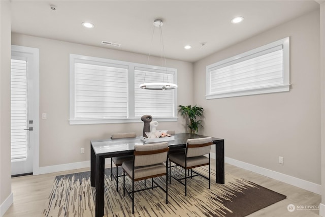 dining room with light hardwood / wood-style flooring