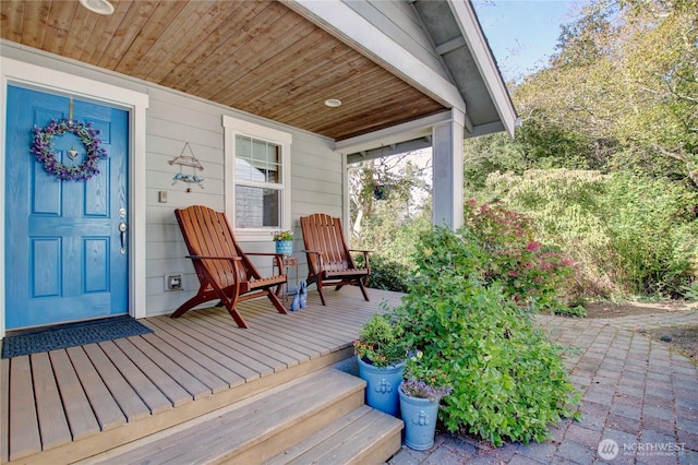 wooden terrace with a porch