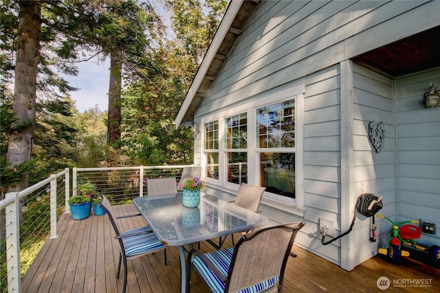 wooden deck with outdoor dining area