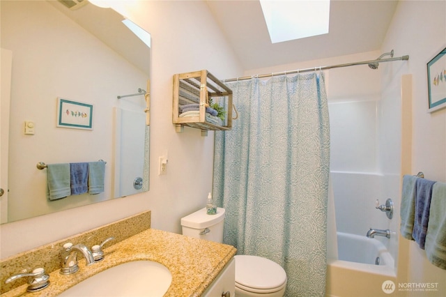 bathroom featuring vanity, vaulted ceiling with skylight, toilet, and shower / bathtub combination with curtain