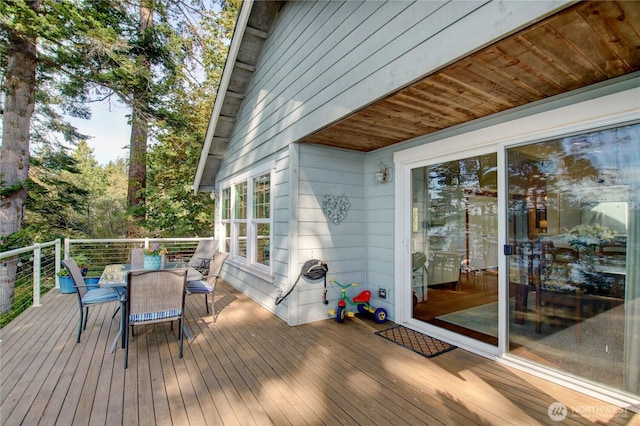 deck with outdoor dining space