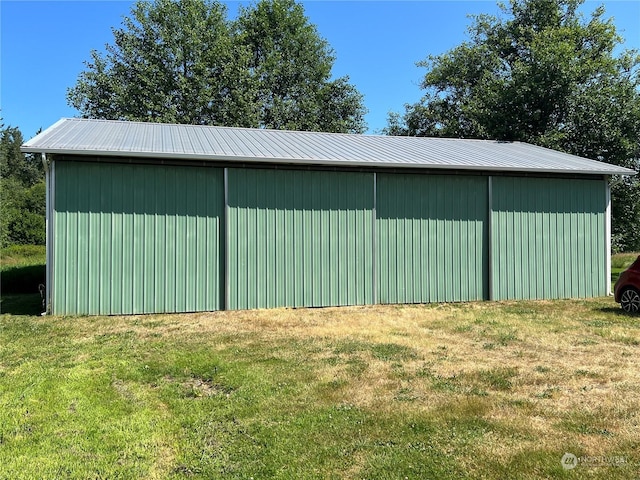 view of pole building with a lawn