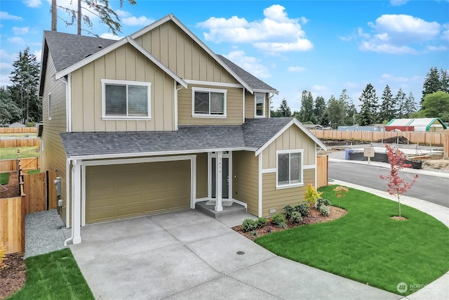 view of front facade featuring a garage and a front lawn