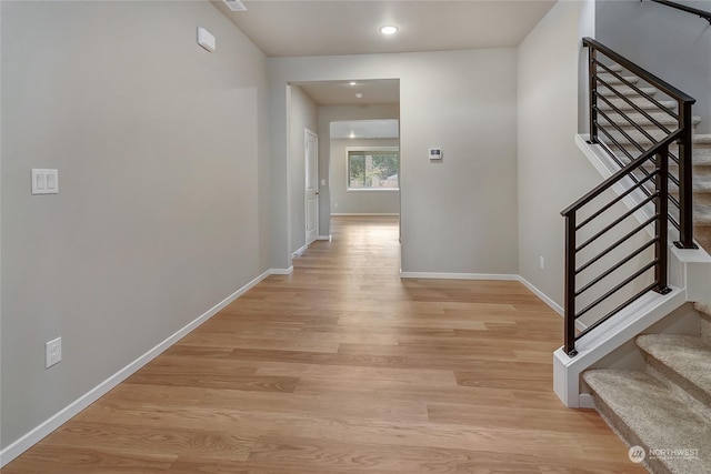 hall with light hardwood / wood-style floors