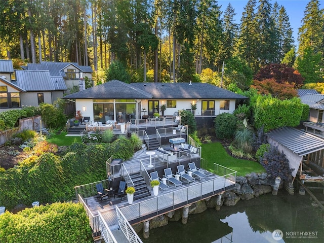 back of property with a patio and stairs