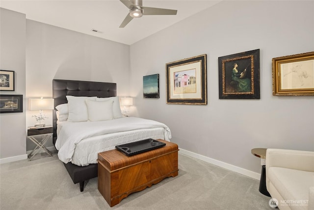 bedroom with baseboards, visible vents, light colored carpet, and ceiling fan