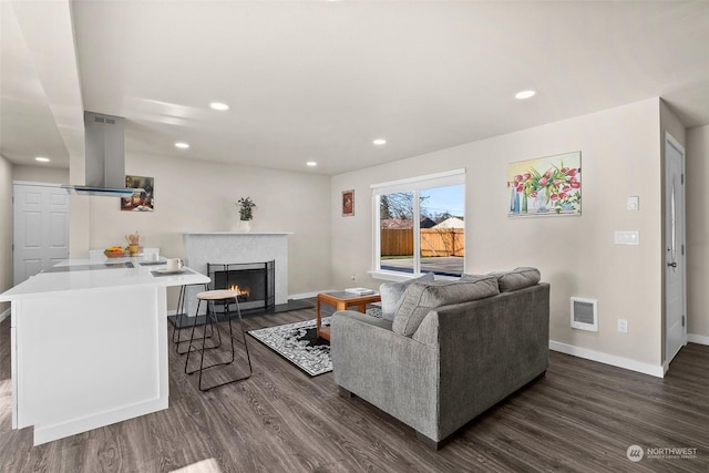 living room featuring dark hardwood / wood-style floors