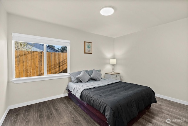 bedroom with hardwood / wood-style floors