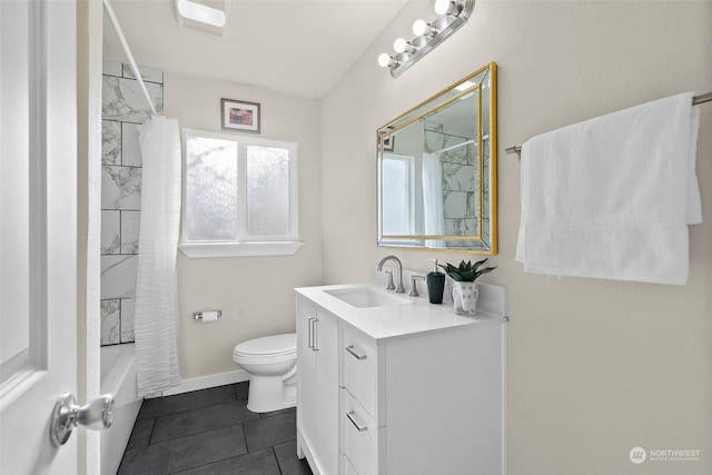 full bathroom featuring vanity, shower / tub combo with curtain, tile patterned floors, and toilet