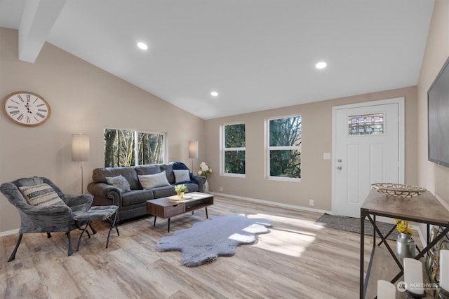 living room with beam ceiling, high vaulted ceiling, and light wood-type flooring