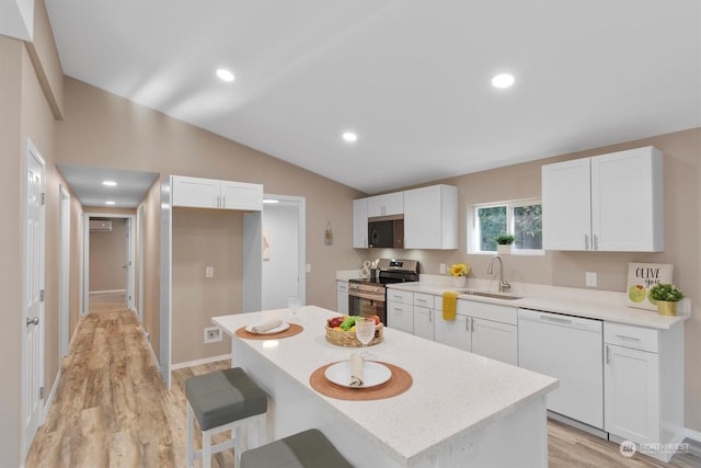 kitchen featuring white cabinetry, sink, dishwasher, and stainless steel electric range oven