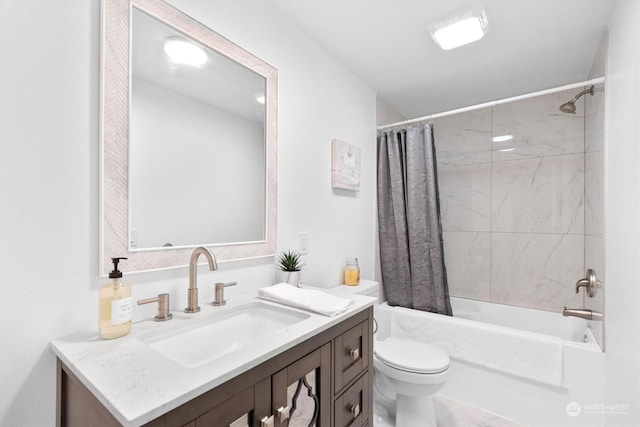 full bathroom with vanity, shower / bath combo, and toilet