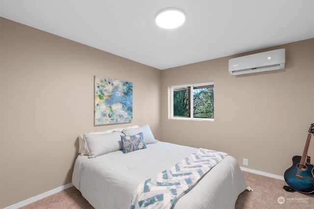 bedroom with a wall mounted AC and carpet