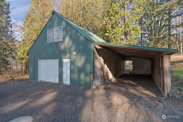 garage featuring a carport