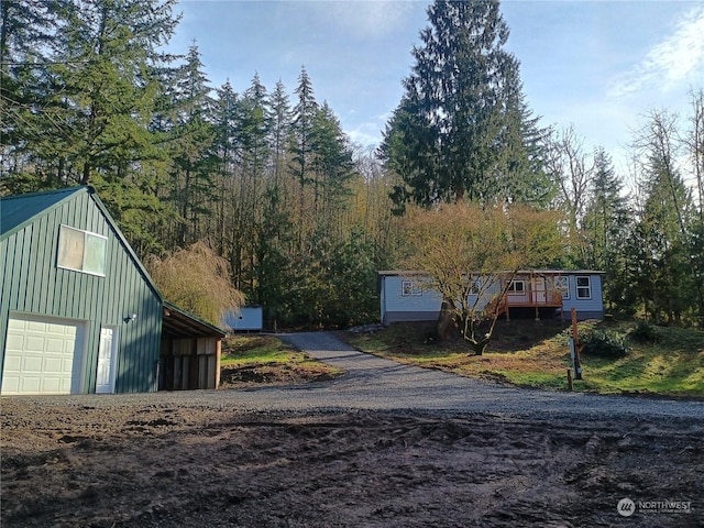 exterior space featuring a garage and an outdoor structure