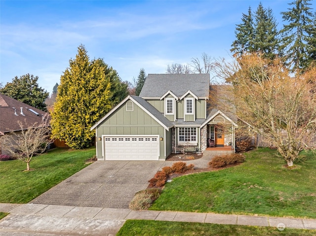 view of front of house featuring a garage and a front yard