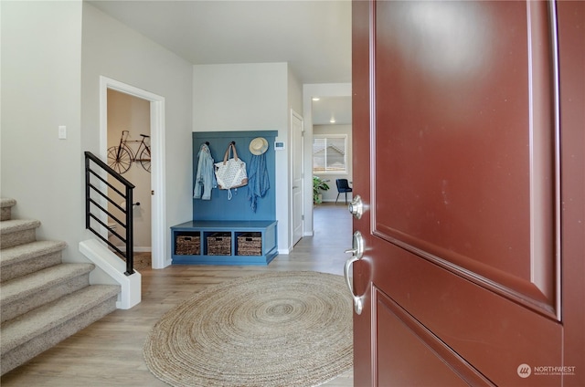 foyer entrance with light hardwood / wood-style flooring